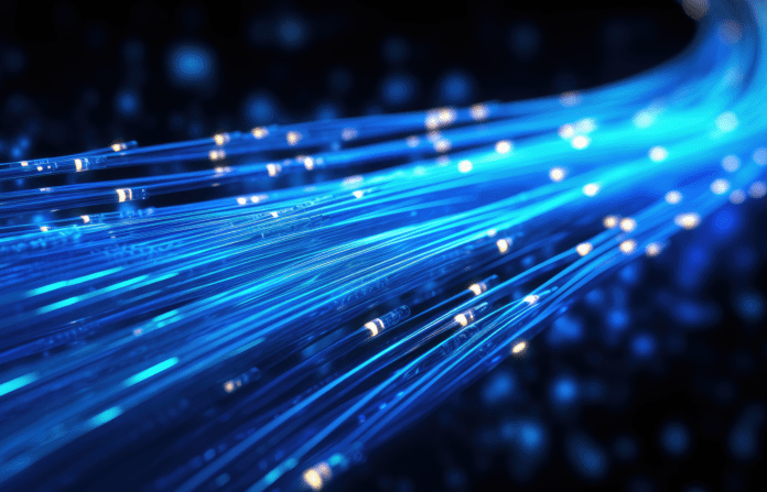 Glowing blue strands of fiber optic cables illustrating digital connectivity.